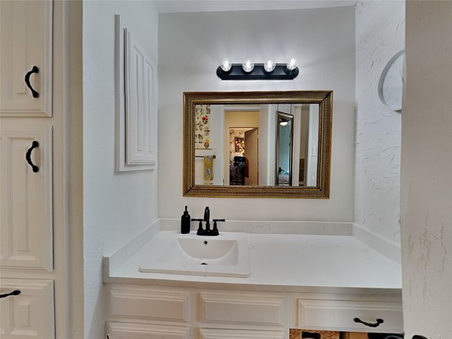 Bathroom featuring vanity | Image 12