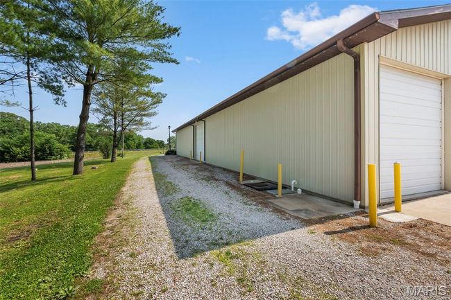 View of home's exterior featuring a garage | Image 36