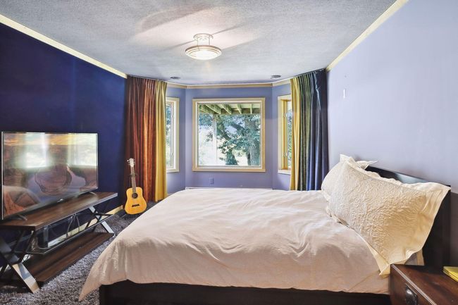 Fabulous 5th bedroom in the lower level features its very own lake views! | Image 38