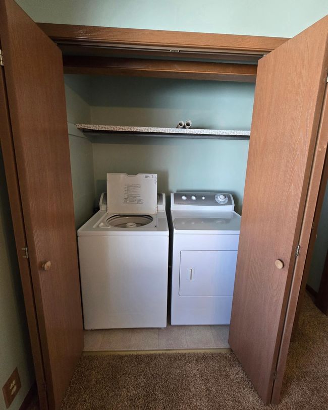 Washer & dryer located in guest bedroom closet | Image 18