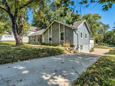 View of front of home featuring a garage and a front lawn | Image 3