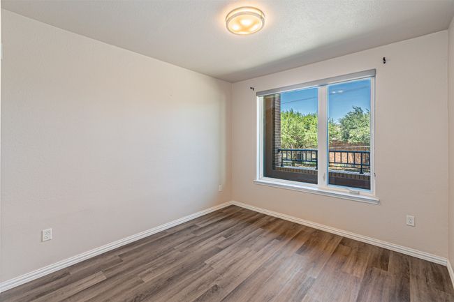 Empty room featuring wood finished floors and baseboards | Image 11