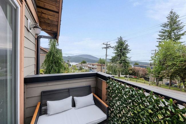 Primary bedroom balcony with ocean and mountain views | Image 23
