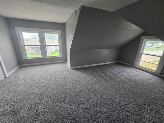 Bonus room with healthy amount of natural light, carpet floors, lofted ceiling, and baseboards | Image 14