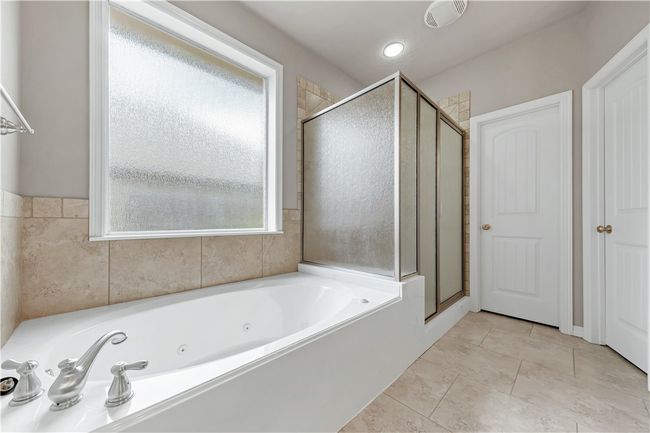 Full bathroom with a stall shower and a tub with jets | Image 22
