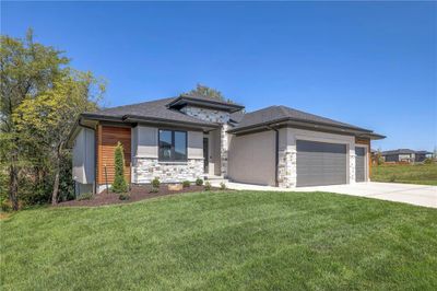 Prairie-style house with a front yard and a garage | Image 2