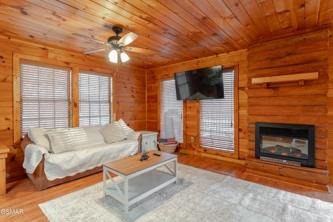 Cabin 2 - Electric Fireplace. There is also a back-up gas heater in the room. | Image 12