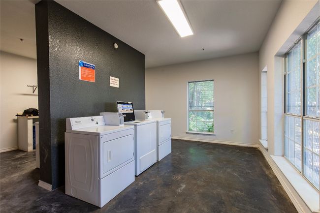 Community laundry featuring separate washer and dryer | Image 14