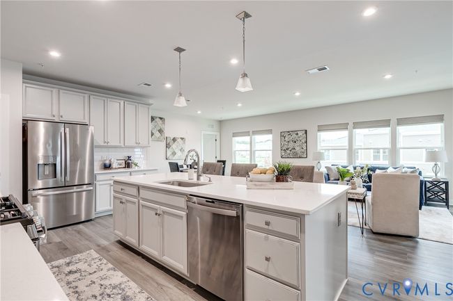 Stylish kitchen with quartz countertops and stainless steel appliances | Image 6
