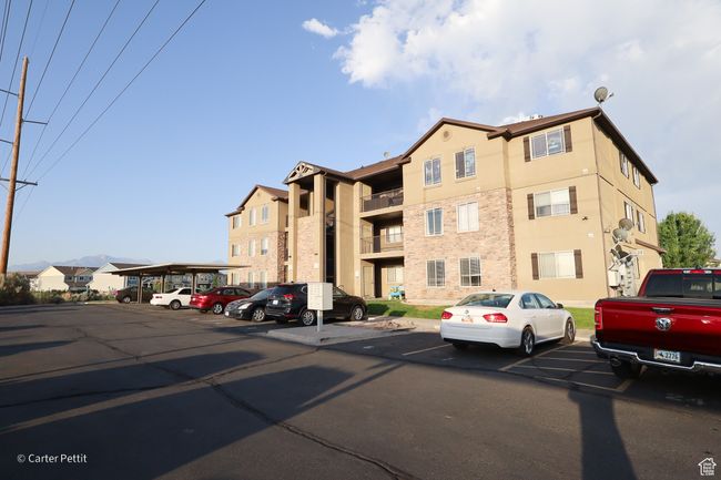 View of property featuring uncovered parking | Image 5