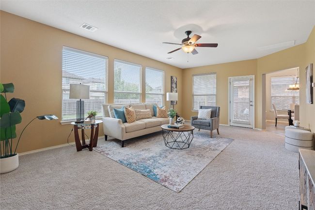 Living room featuring carpet flooring and a ceiling fan | Image 10