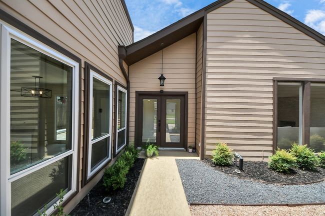 entrance from front gate of the home | Image 50