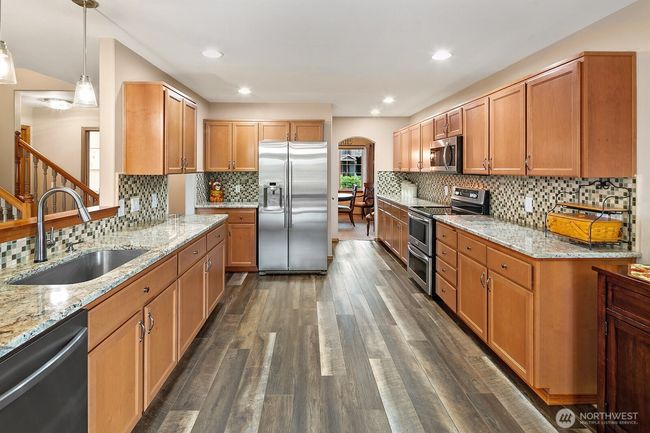 Generously sized kitchen with walk in pantry, double oven, loads of storage and so much counter space! | Image 8