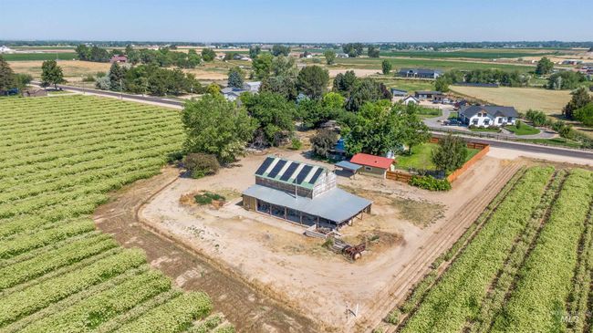 Aerial view of sparsely populated area with large plots for crops | Image 47
