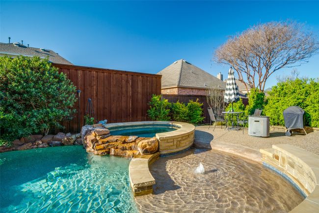 View of pool with a patio area, tanning deck, hot tub, & grilling area | Image 27