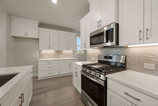 Beautiful cabinetry and finishes in a neutral color palette are waiting for you in this dream home! | Image 8