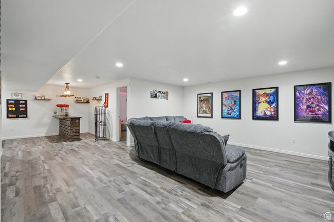 Living room featuring baseboards, recessed lighting, and wood finished floors | Image 35