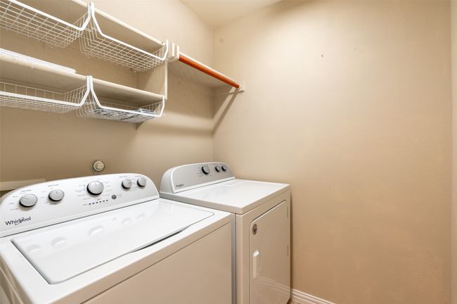 Convenient upstairs separate laundry room. | Image 16