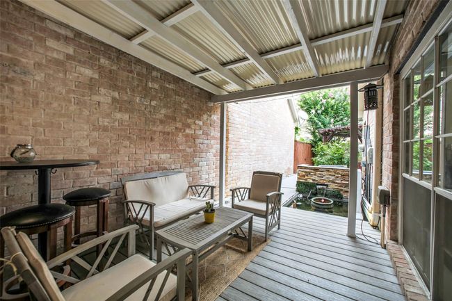 Covered back patio just steps outside the sliding glass doors. | Image 27