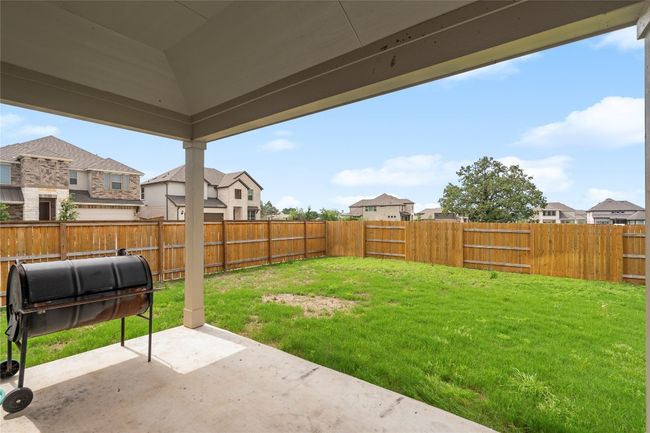 View of yard with a patio and a residential view | Image 33