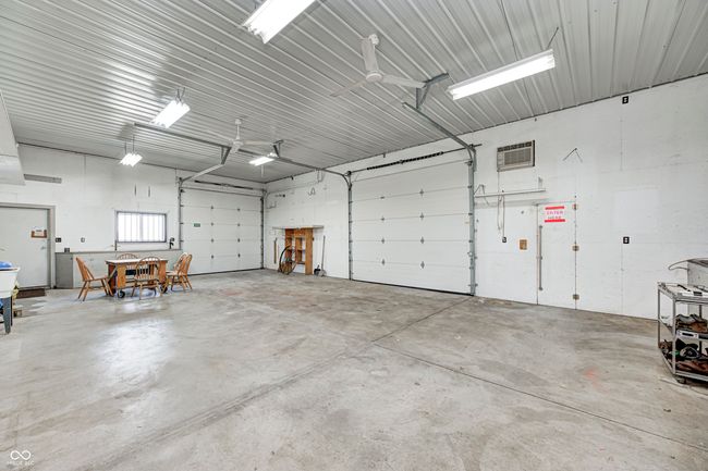 garage featuring metal wall and a wall unit AC | Image 6