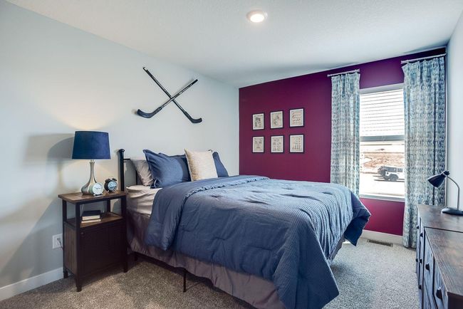 One of 3 secondary bedrooms offered in the Finnegan. Each has a walk-in closet. Photo of model home, colors and selections shown may vary | Image 13