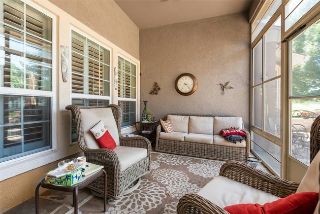 Sunroom / solarium with an outdoor living space | Image 22