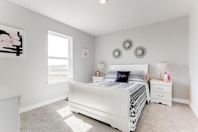 Another large upper level bedroom. Photo of model home, color & options will vary. | Image 16