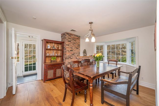 Dining room with exposed brick | Image 12