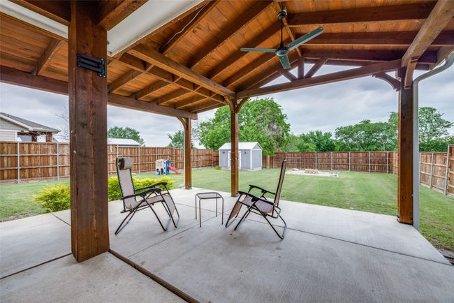 View of patio with a ceiling fan | Image 11