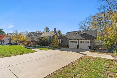 View of front of house with a garage and driveway | Image 2