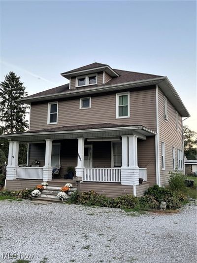 View of front of property featuring a porch | Image 1