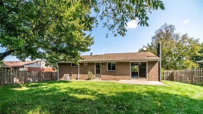 In addition to the large yard, the home offers a rear patio for outdoor entertaining. | Image 25