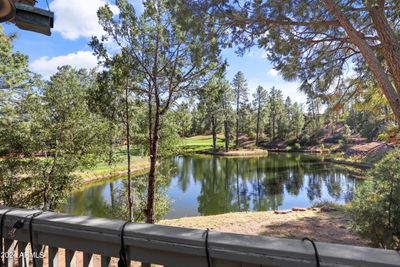 Beautiful views of hole 10 and the signature Chaparral Pines golf course lake. | Image 1