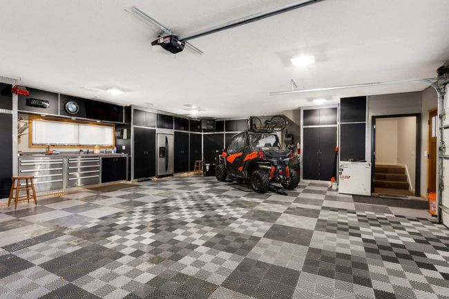 View of the fully finished garage - heated and fully plumbed. Drains in the finished floors too! | Image 9