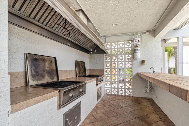 community grill area with bar | Image 25
