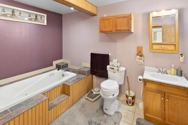 Main level bath with large, jetted tub. | Image 11
