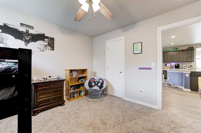 Bedroom featuring light carpet and a ceiling fan | Image 30