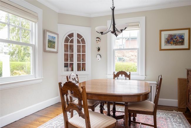 Formal Dining Room with entrances into Kitchen and front hall | Image 10