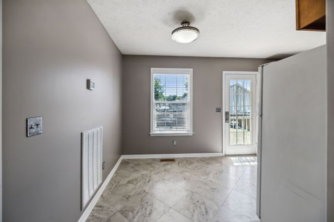 Adjacent to the great room, the dining area seamlessly extends the living space, providing a charming spot for meals with its easy access and cohesive design. 2095 Bolden Drive, Murfreesboro, TN 37127 | Image 13