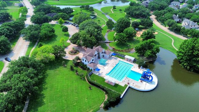 Living in New Territory means enjoying resort-style amenities right in your own community. Residents have access to multiple pools, tennis courts, playgrounds, and scenic walking trails. The clubhouse offers a fitness center, event spaces, and year-round activities for all ages. With top-rated schools, beautiful lakes, and over 450 acres of parks and greenbelts, New Territory is designed for active, connected living. | Image 45