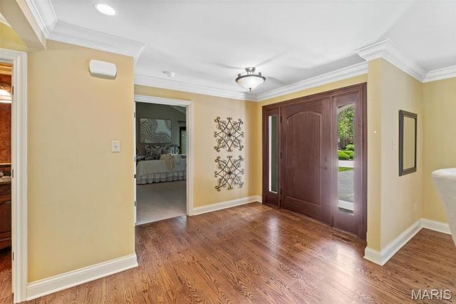 Entrance foyer with wood finished floors and ornamental molding | Image 10