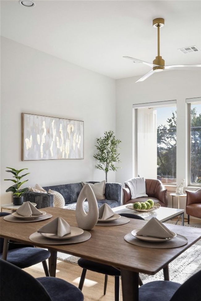 Dining room with visible vents, breakfast area, ceiling fan, and wood finished floors | Image 10