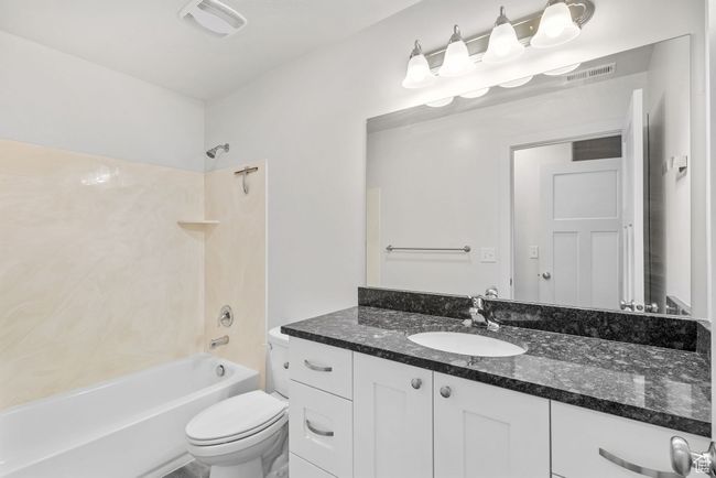 Primary Full bathroom with vanity, bathing tub / shower combination, and toilet | Image 24