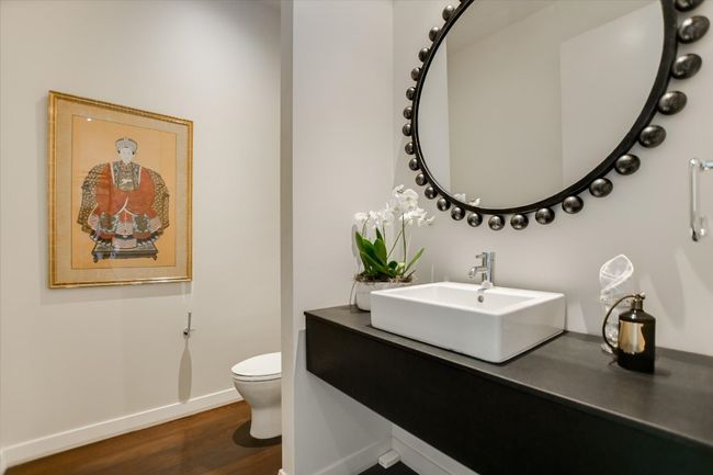 A thoughtfully designed powder room combines modern elegance with refined finishes—perfect for guests and everyday convenience. | Image 18