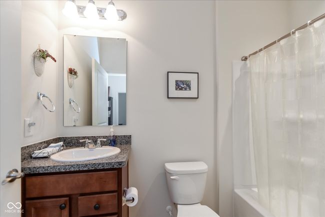 bathroom with vanity and shower / tub combo with curtain | Image 23