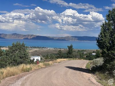 View of road featuring a water and mountain view | Image 3