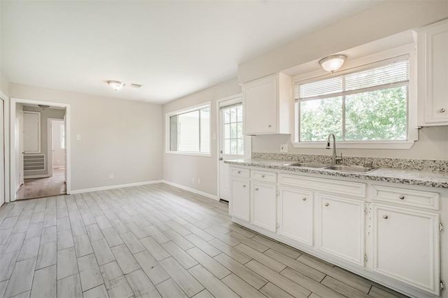 Kitchen opens to dining room | Image 5