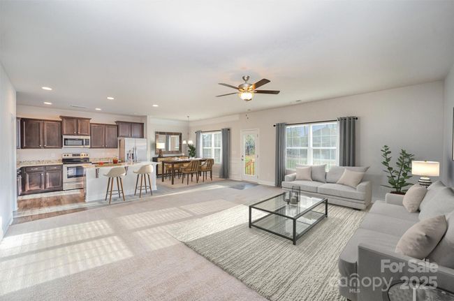 Wide angle shot of the Open Family Room off of the kitchen and breakfast areas. Staged. | Image 5