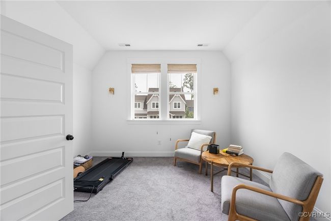 Living area featuring vaulted ceiling, carpet, and baseboards | Image 36
